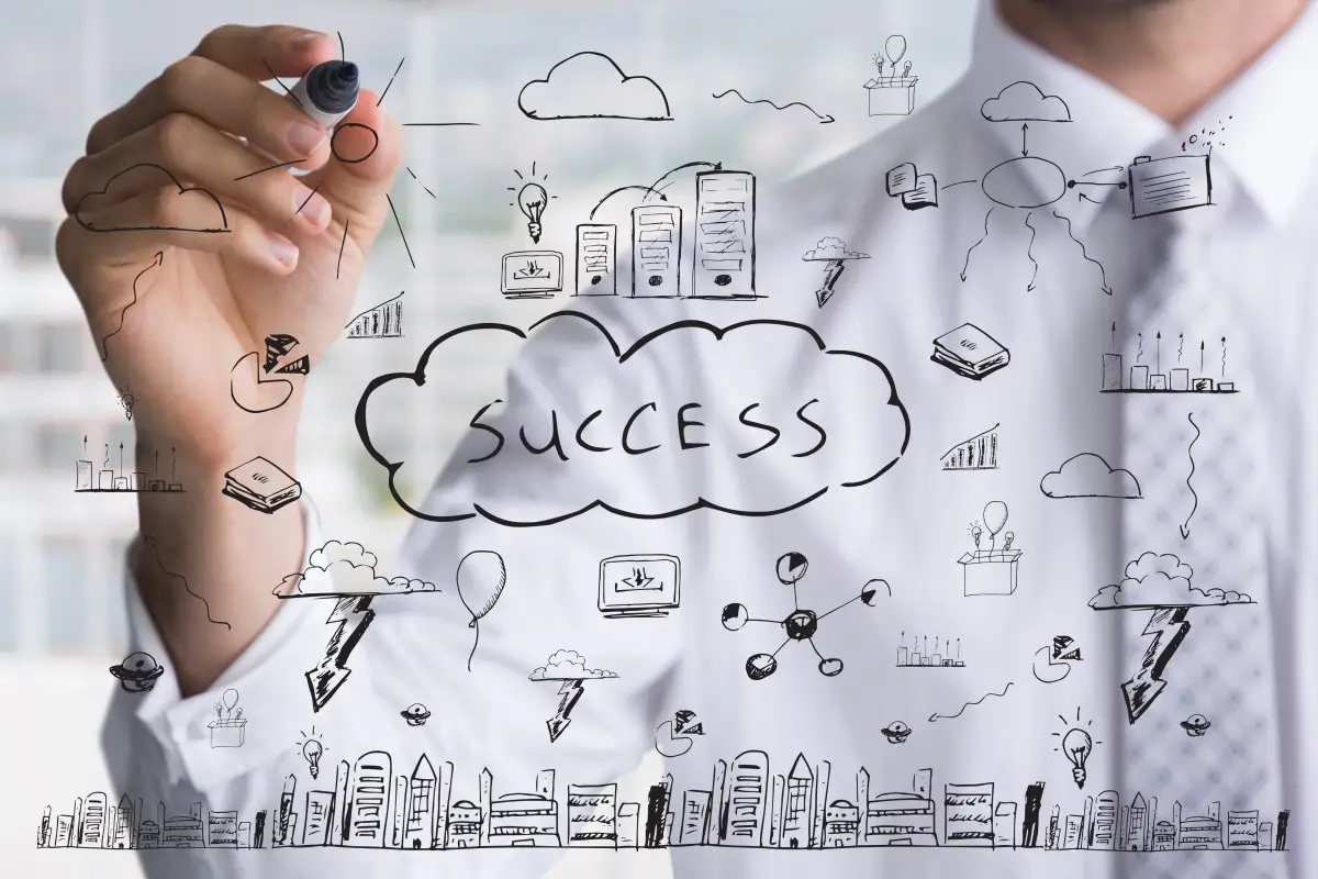 businessman-drawing-keys-success