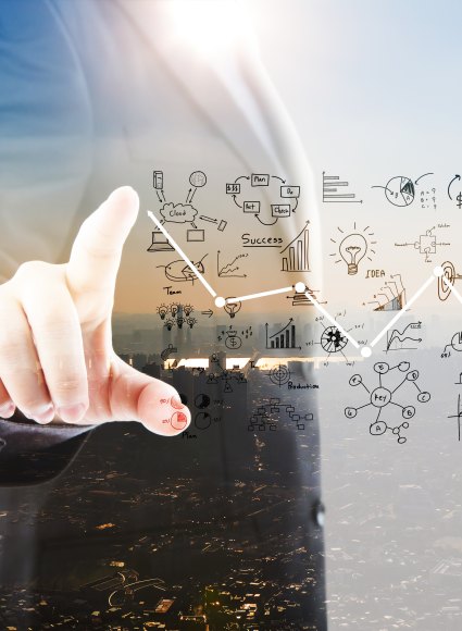 businessman-pointing-graphs-symbols